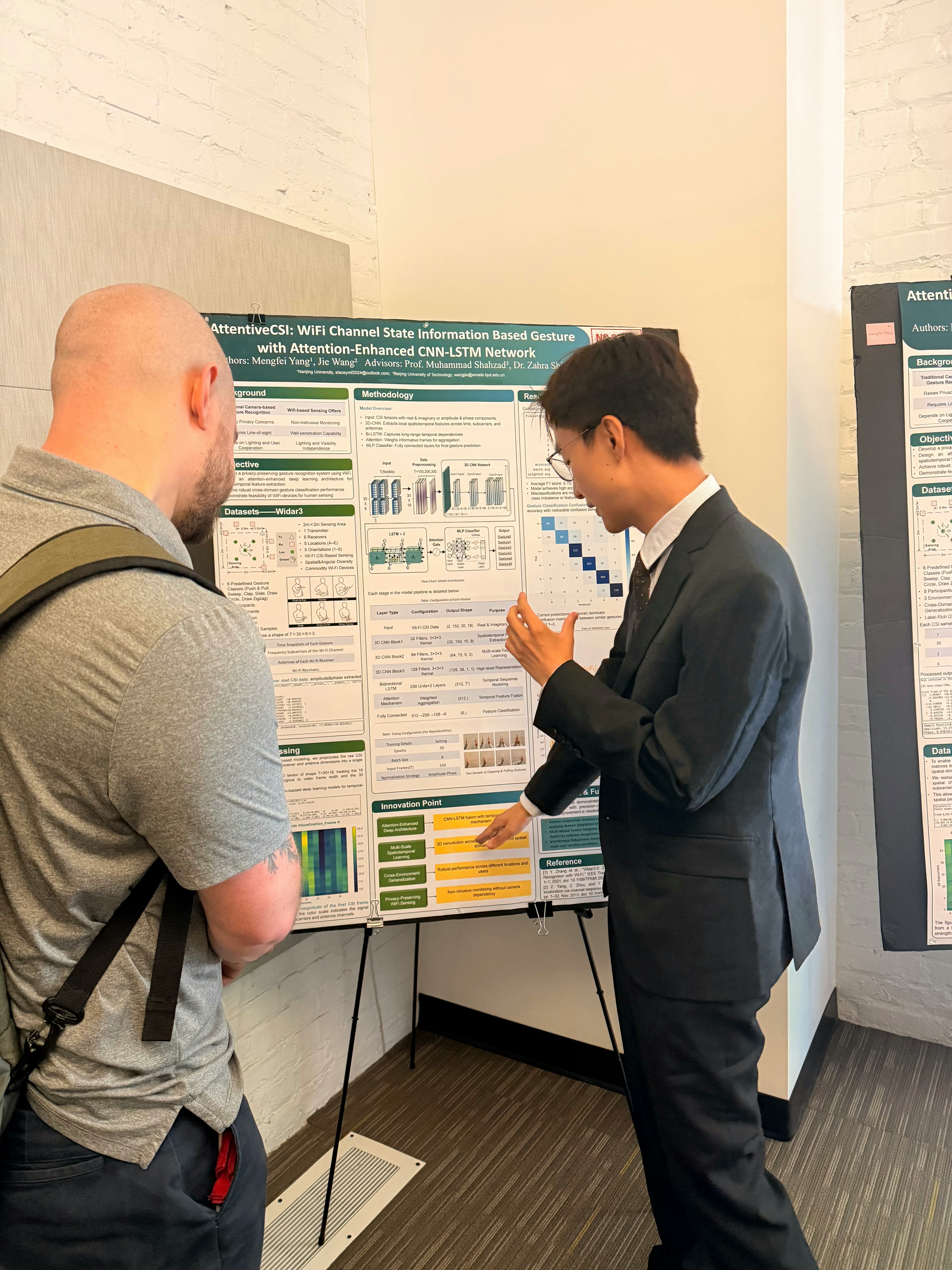 Jie Wang presenting a research poster